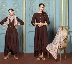 Another Beautiful Designer Drape Patterned Kurti Is Here In Brown Color Fabricated On Rayon Cotton Paired With Satin Silk Fabricated Scarf. This Kurti Is Light Weight And Ensures Superb Comfort Through Out The Gala.