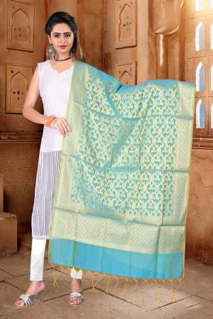 Grab This Pretty Turquoise Blue Colored Dupatta To Pair Up With Your Simple Suit Or Kurti And Give A Glam Look. This Pretty Dupatta Is Fabricated On Banarasi Art Silk Beautified With Weave. Buy Now.