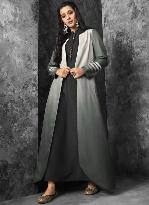 Flaunt Your Rich And Elegant Taste With This Subtle Color Pallete In Black Colored Inner Paired With Grey Colored Jacket. This Readymade Dress Is Available In All Regular Sizes. Buy Now.