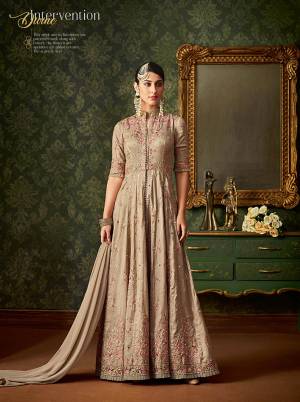 Flaunt Your Rich And Elegant Taste In This Heavy Designer In Beige Color Paired With Beige Colored Bottom And Dupatta. Its Heavy Embroidered Top Is Fabricated On Art Silk Paired With Santoon Bottom And Net Fabricated Dupatta. Buy Now.