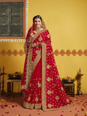 Grab This Pretty Elegant Looking Designer Saree In Red Color Paired With Contrasting Red Colored Blouse. This Saree And Blouse Are Silk Based Beautified With Heavy Jari Embroidery & Embroidery Border. Buy Now.