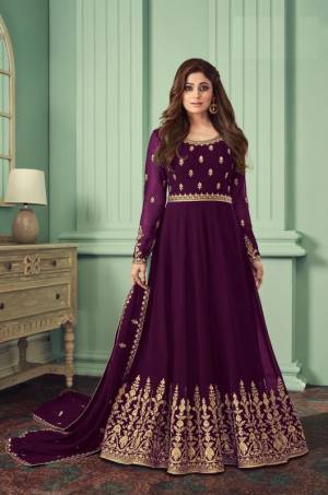 Purple heavily embroidered Faux Georgette Gown Type Anarkali Salwar suit with Shantoon Pant bottom and four side embroidered work dupatta,heavily embroidered Anarkali Suit make for the most comfortable yet fancy ensemble.