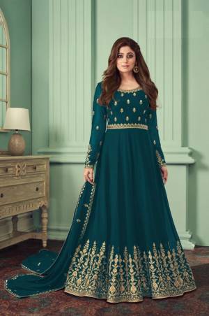 Sea Blue heavily embroidered Faux Georgette Gown Type Anarkali Salwar suit with Shantoon Pant bottom and four side embroidered work dupatta,heavily embroidered Anarkali Suit make for the most comfortable yet fancy ensemble.