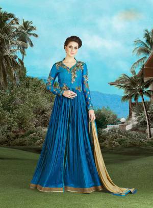 Flow Beautifully With This  Dark Teal Blue Colour Dress At Party And Get Filled With Compliments. This Radiant Dress Is Fabricated on Silk And Is Available With Matching Beige  Colored Chiffon Duptta.