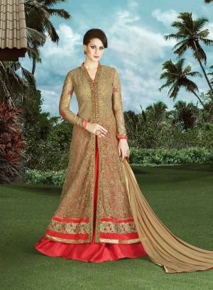 Get Yourself A Special  Suit With Latest Style. Its Fawn Color Graced With Beautiful   Embroidered On Net  Fabric Make This Suit Even More Enticing. Pair It With A Red  Colored Silk Fabric Bottom And Fawn Colored Chiffon Dupatta. Buy This Dress Now.