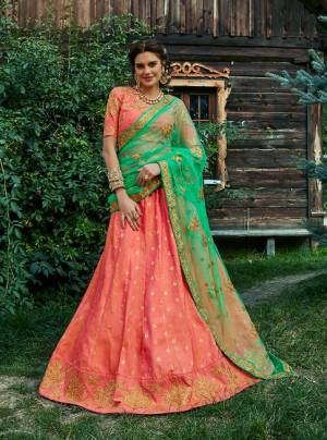 Indulge Yourself In The Wedding Fiesta Grab This Old Rose & Rama Colored Designer Lehenga Choli And Look Divalicious For Your Special Day. This Beauteous Lehenga Choli Is Featured With Stone Work Designs and Cut Work.