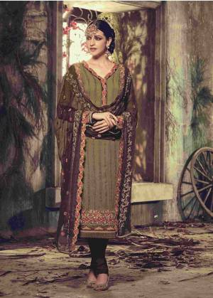 Go Trendy With This Georgette Fabricated Suit Paired With Santoon Bottom And Chiffon Dupatta. Its Beautiful Vibrant Colors That Are Green And Brown Will Make You Look The Most Attractive Of All. This Suit Is Comfortable To Carry All Day Long With Ease.