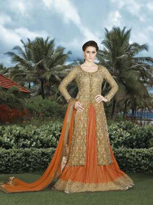 Look Beautiful In This Indo-Western Dress In Beige Color Paired With Orange Colored Lehenga And Dupatta. Its Top Is Fabricated On Net Beautified With Jari Embroidery and Stone Work  Paired With Art Silk Fabricated Lehenga And Chiffon Fabricated Dupatta. Grab It Now. 