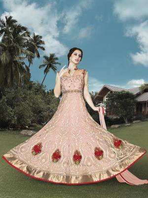 Summer Calls For Easy Glamour And Pastel Play On Colors And Design. Try Out This Designer Floor Length Dress In Pastel Pink Colored Fabricated On Net With Detailed Embroidery All Over The Top. Buy This Designer Suit Now.