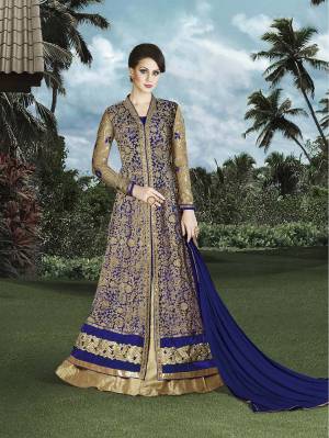 A Totally Different Color In Indo-Western Dress Is Here In Beige And Indigo Color. This Bright Indigo Color Will Make You Look The Most Attractive Of All At The Party. Pair This Up With Golden Maang Teeka And Complete The Look.