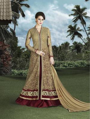 Look The Most Happening Of All This Beige And Maroon Colored Indo-Western Dress. This Dress Is Beautified With Thread Embroidery And Stone Work All Over The Top. Its Top Is Fabricated On Net  Bottom Is In Art Silk And Chiffon Fabricated Dupatta 