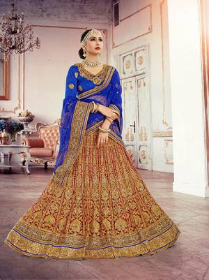 Here Is The Another Color In  Heavy Lehenga For The Next Wedding You Attend. This Red Colored Lehenga Is Paired With Royal Blue Colored Blouse And Dupatta. This Heavy Lehenga Is Fabricated On Net And Blouse Is Fabricated On Art Silk With Haevy Embroidery All Over.