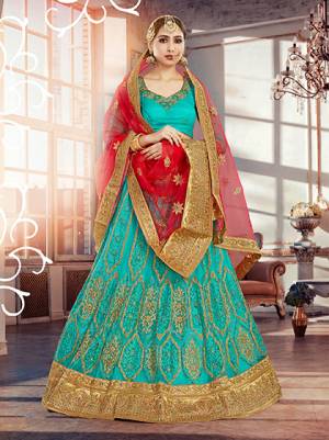 For An Indian Beauty  Here Is The Lehenga Choli Which Will Earn You Lots Of Compliments At The Next Wedding You Attend. Grab This Sea Green Colored Lehenga Paired With Red Colored Blouse 