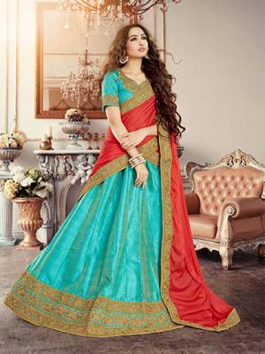 Hues Of Blue Always Looks Great In any Day Or Night time Function. Grab This Turquoise Blue Colored Lehenga Choli Paired With Crimson Red Colore Duptta. This Lehega Choli Is Fabricated On Art Silk And Duptta Is Crafted On Net. Both The Fabrics Ensures Great Comfort Throughout The Gala. Buy This Lehenga Choli Now.