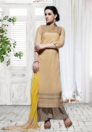 A Must Have Color In All The Womens Wardrobe Out There. Add This Beige Colored Plazzo Suit To Your Wardrobe Paired With Yellow and Beige Shaded Dupatta. This Suit Is Fabricated On Cotton Which Keeps You Cool All Day Long.