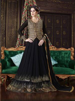 Look Bold And Beautiful in This Black Colored Designer Suit. This Floor Length Suit Is Fabricated On Georgette With Art Silk Fabricated Jacket Over The Suit. It Also Has Beautiful Sequence Embroidery At The Panel. Buy This Pretty Suit Now.