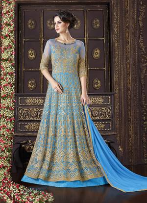 Get Ready For The Next Wedding Function At Your Place With This Awesome Floor Length Designer Suit. This Pretty Suit Is Fabrictaed On Net With Heavy Embroidery All Over The Suit. This Suit Is Beautified With Jewled Neckline. Grab This Suit Now.