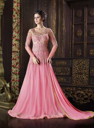 Earn Lots Of Compliments Wearing This Pretty Pink Colored Floor Length Suit Beautified With Heavy Jari And Thread Embroidery In Very Unique Designer Pattern. This Designer Suit Is Fabricated On Net Which Ensures Superb Comfort Throughout The Day.