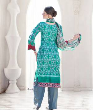For A Pretty Amazing Look  Grab This Green Colored Suit Paired With Grey Colored Bottom And White & Green Colored Dupatta. This Dress Material Is Fabricated On Cotton Which Is Soft Towards Skin Comfortable To Carry All Day Long. 