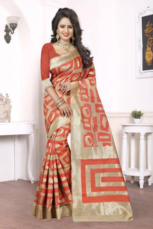 Grab This Orange And Beige Colored Saree Paired With Orange Colored Blouse. This Saree Is Fabricated On Kanjivaram Art Silk Which Is In High Demand. Grab This Pretty Saree Now.