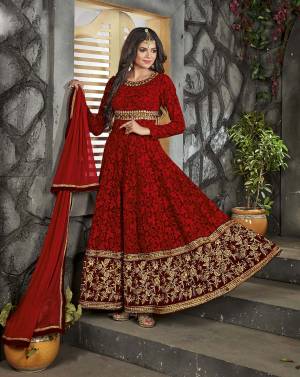 Catch All The Limelight Wearing This Bright And Beautiful Dark Red Colored Suit And Earn Lots Of Compliments From Onlookers. This Pretty Suit Is Fabricated On Georgette With Heavy Embroidery All Over The Suit. Buy This Pretty Saree Now.