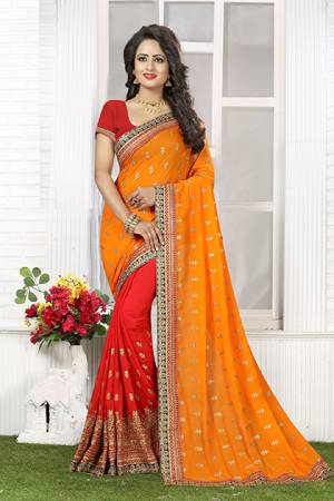 For A True Ethnic Beauty  Grab This Traditional Bright Colored Saree Orange And Red Paired With Red Colore Blouse. This Traditonal Saree Is Fabricated On Crush Chiffon Which Is Soft Towards Skin And Light In Weight. Buy This Saree Now. 