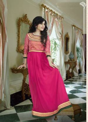 Doll Up In This Rani Pink Colored Gown With A Very Pretty Braso Fabricated Yoke Pattern.  This Pretty Floor Length Gown Is Fabricated On Georgette Which Is Soft Towards Skin And Light In Weight. Buy This Gown Now.