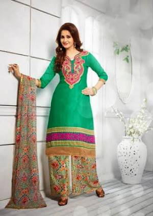 If Those Readymade Suit Does Not Lend You A Desired Fit  Than Grab This Green Colored Dress Material Paired With Multi Colored Bottom And Dupatta. This Casual Suit Is Fabricated On Cotton With Chiffon Dupatta. Grab It Now. 