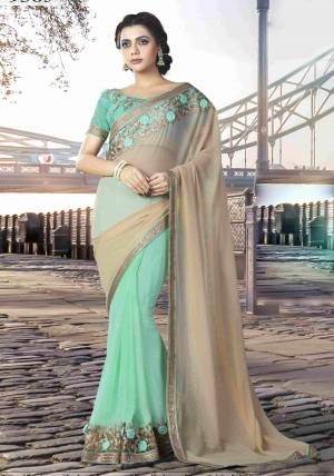 Exude An Amiable Composure In This Pale Khaki And Aqua Blue Colored Designer Saree And Look Like Gentle And Mod. 