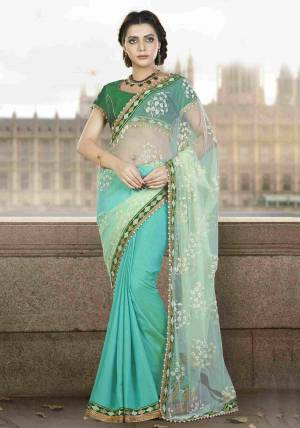 Green Is The Color Of Harmony And Grace. Look Tranquil In This fresh Pastel Green And Sea Green Colored Designer Saree And Pair With Pearl Jewels To Uplift The Look. 