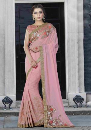 Pink Is A Color Of Feminine Serenity. Pair This Pretty Baby Pink Colored Saree With Traditonal Jhumkis To Uplift The Whole Attire.
