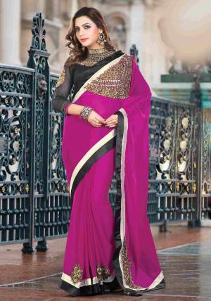 Bright, Vibrant And Vivacious This Magenta Pink Colored Saree Paired With Black Colored Blouse When Paired With Minimal Jewelry Will Make You Look Peppy. 
