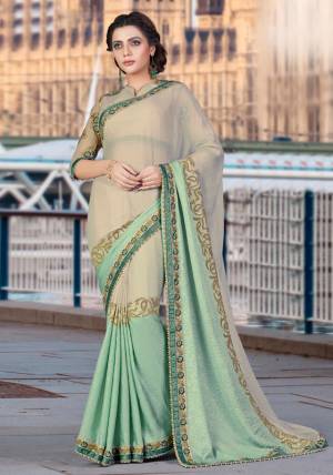 Simple Is The New Contemporary. Grace Your Next Event In This Classy Pale Khaki And Mint Green Colored Saree And Look Divaesque.