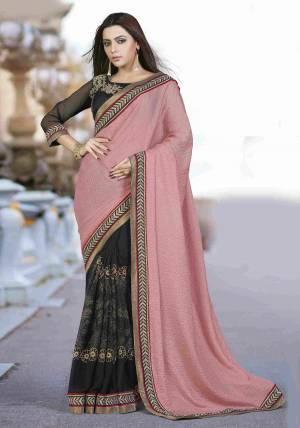Hold Yourself To The Standard Of Bold And Exquisite Grace In This Pretty Dusty Pink And Black Colored Saree Paired With Black Colored Blouse And Look Lady-Like In This Beautiful And Elegant Saree.