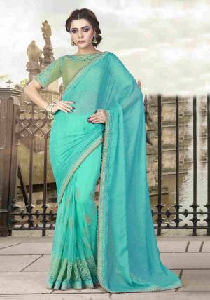 Aqua Blue Is A Shade Of Feminine Ferenity. Look Sober And Serene In This Basic Aqua Blue Colored Saree Paired With Mint Green Colored Blouse And Exude Simplicity. 