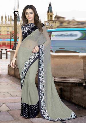 Grey With A Pop Of Black Adds The Ultimate Sass To Any Outfit. Create An Ultimate Party-Wear Look In This Plae Grey Colored Saree Paired With Black Colored Blouse And Look Stylish.