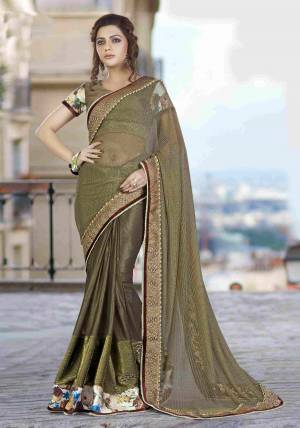 Embrace This Army Green Colored Unique-Toned Saree And Pair With A Statement Necklace And A Floral Printed Clutch To Look Elegant And Beautiful.