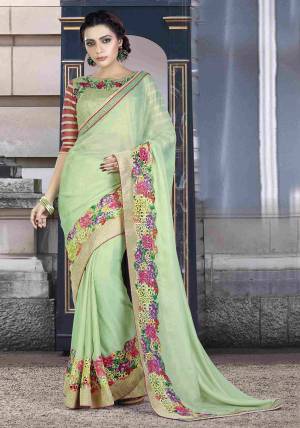 Well Arranged Colors Speak A Different Poetry. Wear This Meticulously Designed Pastel Green Colored Saree Paired With Mint Green Colored Blouse In Your Next Day Out And Look Glam. 