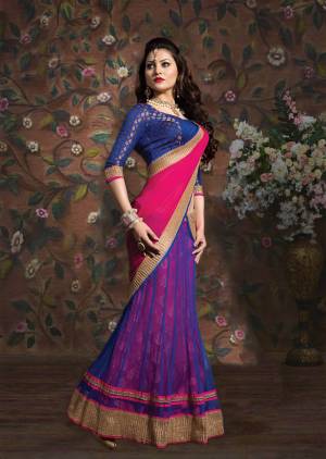 Grab This Beautiful Blue Colored Lehenga Choli Paired With Cntrasting Pink Colored Dupatta. Its Blouse Is Fabricated On Brocade Paired With Net And Brocade Fabricated Lehenga And Chiffon Dupatta. 