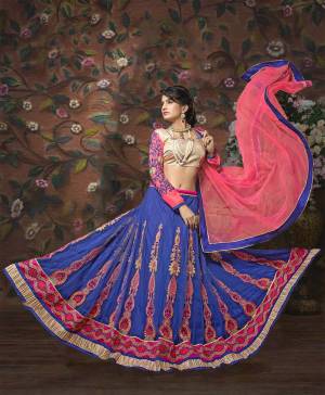 For A Heavy Look, Grab This Lovely Lehenga In Beige Colored Blouse Paired With Blue Colored Lehenga And Pink Colored Dupatta. Its Blouse Is Fabricated On  Art Silk Paired With Net Fabricated Lehenga And Dupatta. It Is Easy To Carry All Day Long. Buy Now.