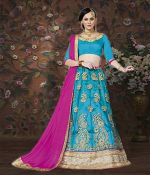 Look Beautiful In This Turquoise Blue Colored Lehenga Choli Paired With Contrasting Rani Pink Colored Dupatta. This Lehenga Choli Will Definitely Earn You Lots Of Compliments From Onlookers. Buy Now.