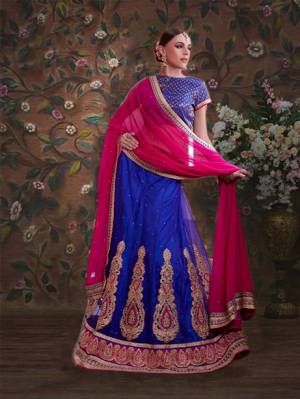 Bright And Visually Appealing, Here Is A Pretty Royal Blue Colored Lehenga Choli Paired With Contrasting Dark Pink Colored Dupatta. Its Blouse Is Fabricated On Brocade Paired With Net Fabricated Lehenga And Chiffon Dupatta. All Fabrics Ensures Great Comfort Throughout The Gala. Buy Now.