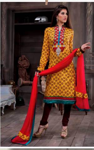 Shine Bright With This Yellow Colored Suit Paired With Browm Colored Bottom And Red Colored Dupatta. This Dress Material Is Fabricated On Cotton Paired With Chiffon Dupatta. Get This Suit Now.