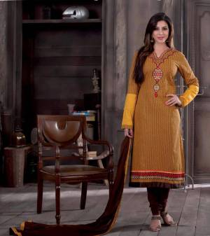 Go Casual This Season With This Cotton Fabricated Dress Material Paired With Chiffon Dupatta. Its Yellow Colored Top Is Paired With Contratsing Brown Colored Bottom And Dupatta. Buy This Lovely Suit Now.