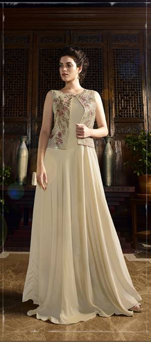 Flaunt Your True Elegance Wearing This Lovely Beige Colored Gown Fabricated On Satin Silk. This Designer Gown Is Beautifully Patterned In Jacket Style With Sophisticated Embroidery. Buy This Readymade Gown Now.