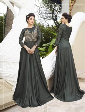 Enhance Your Personality Wearing This Awesome Dark Grey Colored Gown. This Designer Gown Is Fabricated On Satin Silk With Elegant Embroidery. It Is Light In Weight And Easy To Carry All Day Long. Buy It Now. 