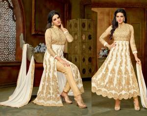 Adorn The Angelic Look In This White Colored Attire. Its Top Or Blouse Is In Beige Color Paired With White Colored Skirt And Dupatta With Beige Colored Dupatta. Get This Stitched As An Anarkali Or Lehenga Choli. Buy This Suit Now.