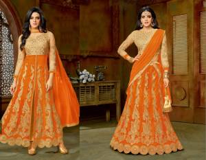Orange Color Induces Perfect Summery Appeal To Any Outfit. Grab This Beige Colored Top And Bottom Paired With Orange Colored Skirt And Dupatta. This Attire Can Be Made In Two Different Ways, One As An Anarkali Or As A Lehenga Choli As Per Your Wish.
