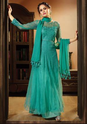 Celebrate This Festive Season With Comfort And Beauty Wearing This Floor Length Suit In Sea Green Color Paired With Sea Green Colored Bottom And Dupatta. Its Top Is Fabricated On Net Paired With Santoon Bottom And Chiffon Dupatta. It Has Beautiful Tone To Tone Embroidery Over The Top. Buy Now.