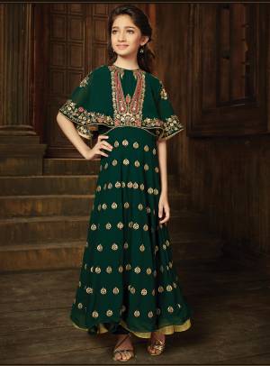 Make Your Girl Look Trendy And Classy With This Cape Patterned Floor Length Gown Style Suit. Its  Beautiful And Attractive Pine Green Color Will Make Her Earn Lots Of Compliments From Onlookers. 